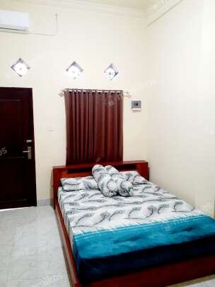 Room with a bed and a desk