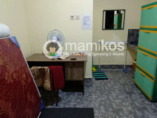 Room with a bed and a desk