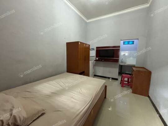 Room with a bed and a desk